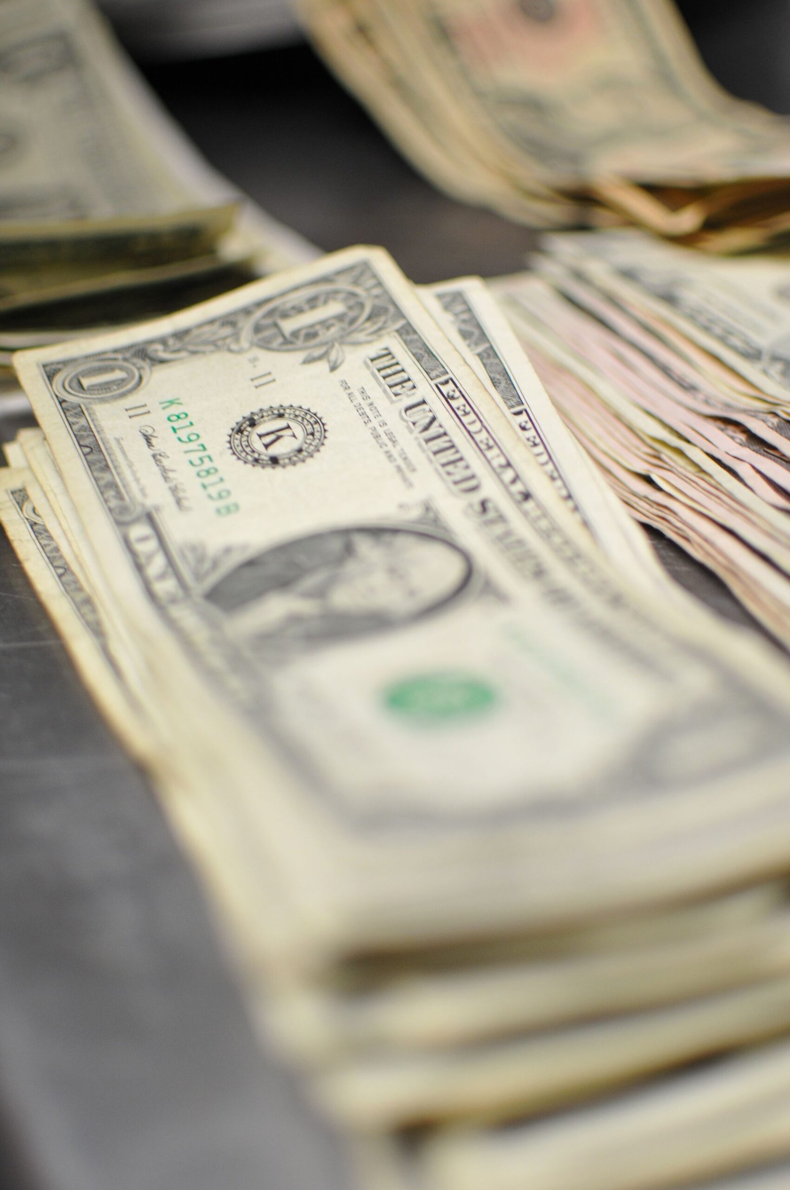 Stack of US dollar bills representing energy sector M&A deals