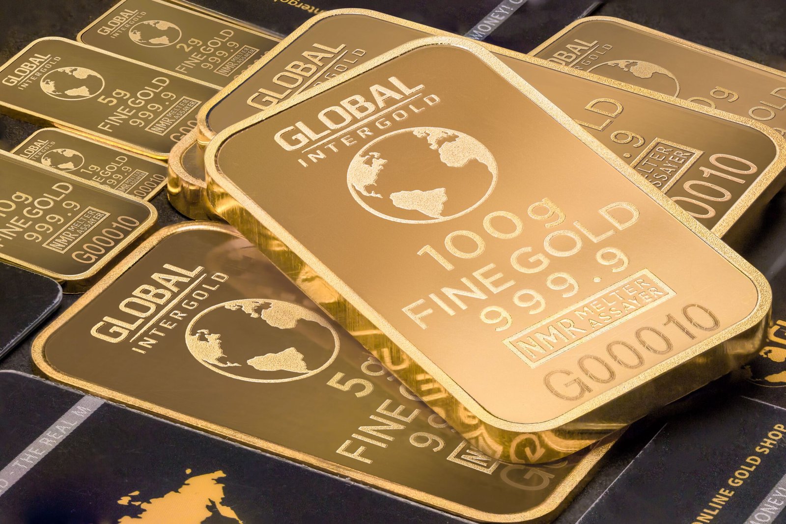 Gold bars representing OPEC+ oil output decision and commodity markets