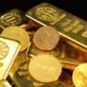 Gold and silver bullion coins representing silver price movement